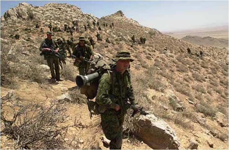 Canadian soldiers from 3PPCLI move into the hills to search for Al Qaeda and Taliban fighters. These soldiers are participating in Operation Cherokee Sky in support of Operation Enduring Freedom. (Credit: Staff Sgt. Robert Hyatt, USA, July 2002)